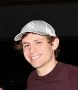 Thomas Fairhurst, smiling, in a grey cap
